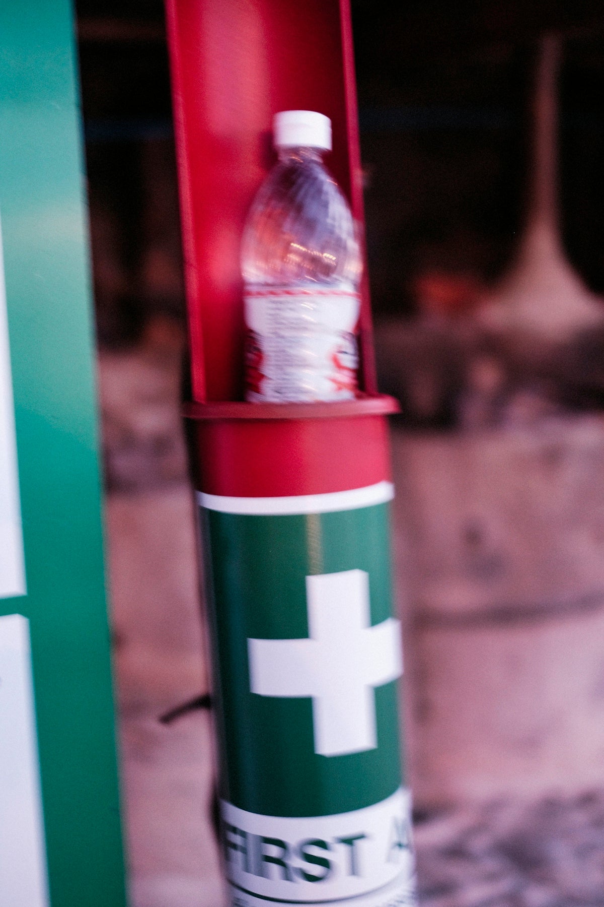 Water bottle sits inside a first aid kit.
