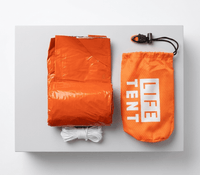 Orange emergency life tent with packaging on a white background
