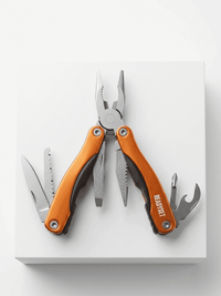 Multitool with orange handle on a white background